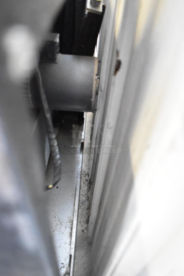 Duke commercial full-size convection oven interior; view through doors, thermostatic controls, minor wear visible.