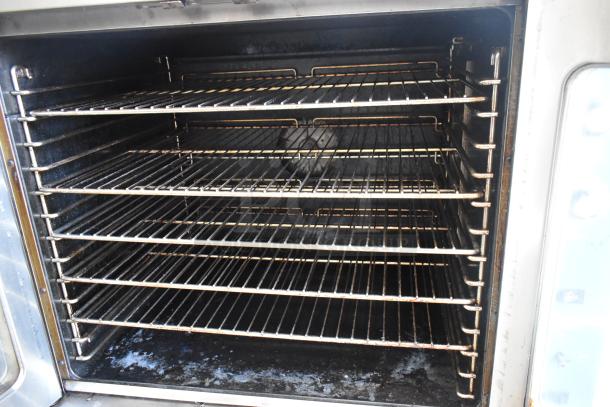 Duke commercial full-size convection oven, view-through doors, thermostatic controls, multiple wire racks, used condition.