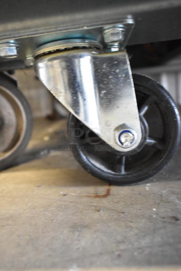 Avantco 178A49RHC cooler caster, durable commercial design. 115V, 1 Phase. Shows metal finish and black wheel.