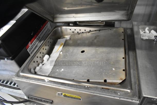 Roundup DFWT-150CF Commercial Deluxe Food Warmer, stainless steel, 120 volts, 1 phase. Visible caution label on the front.