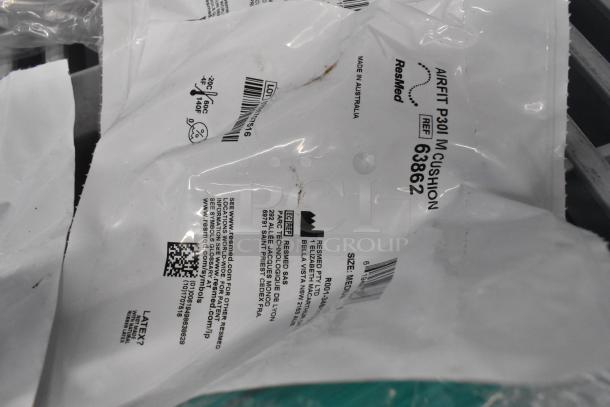 16 assorted items in packaging including ResMed Airfit P30I Cushion, REF 63862, size M. Appears new, sealed.