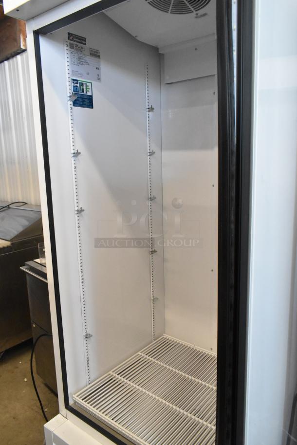 2021 True TSCI-600R-G-PH single door cooler, 115V, 1 phase, pristine condition, adjustable shelving, energy label visible.