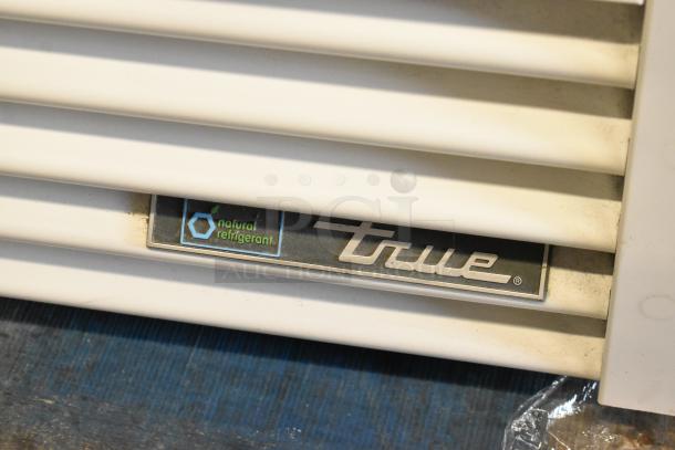 2021 True TSCI-600R-G-PH cooler merchandiser, single door, 115V, 1 phase, with natural refrigerant label.