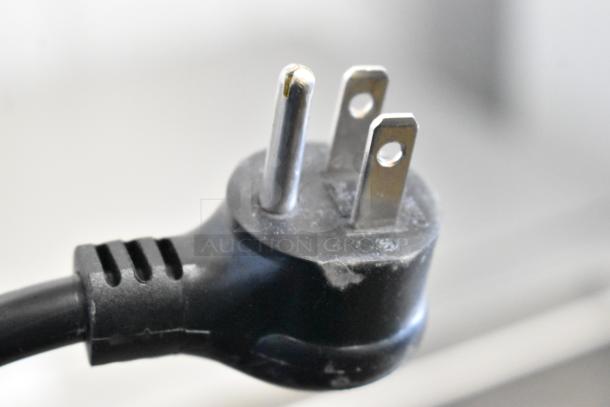 Close-up of a three-prong plug for the Summit SPR627OS2D 2 Drawer Undercounter Cooler. 115 Volts, 1 Phase.