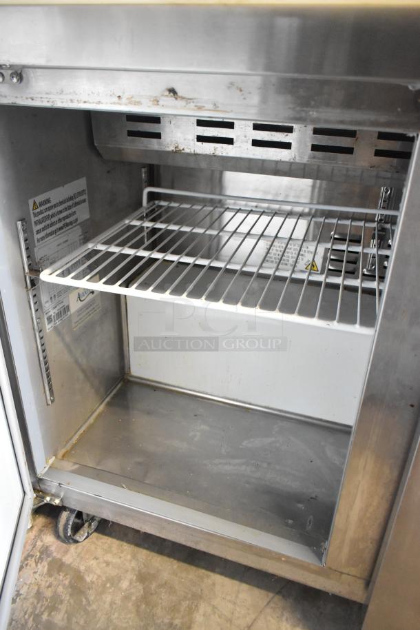 Avantco 178APT71HC prep table with wire shelving shown, stainless interior, visible wear. 115 volts, 1 phase.