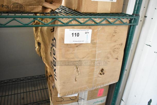 "Galaxy 177GCU100 Coffee Urn box, shows scratches and dents, '110 QTY' label visible, PCI Auctions website."