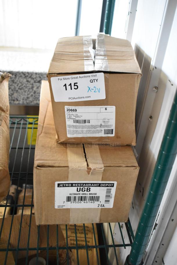 Two boxes labeled 20669 steamtable pan and Jetro UGB-JET grill brush, new in original packaging, marked scratch and dent.