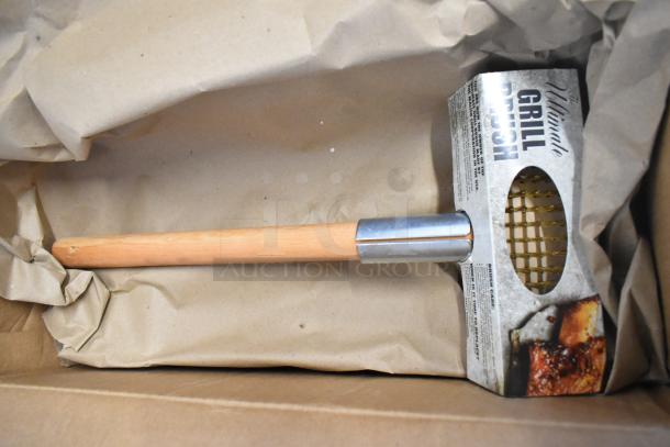 Jetro UGB-JET Ultimate Grill Brush, new, with wooden handle and metal bristle head, partially in packaging.