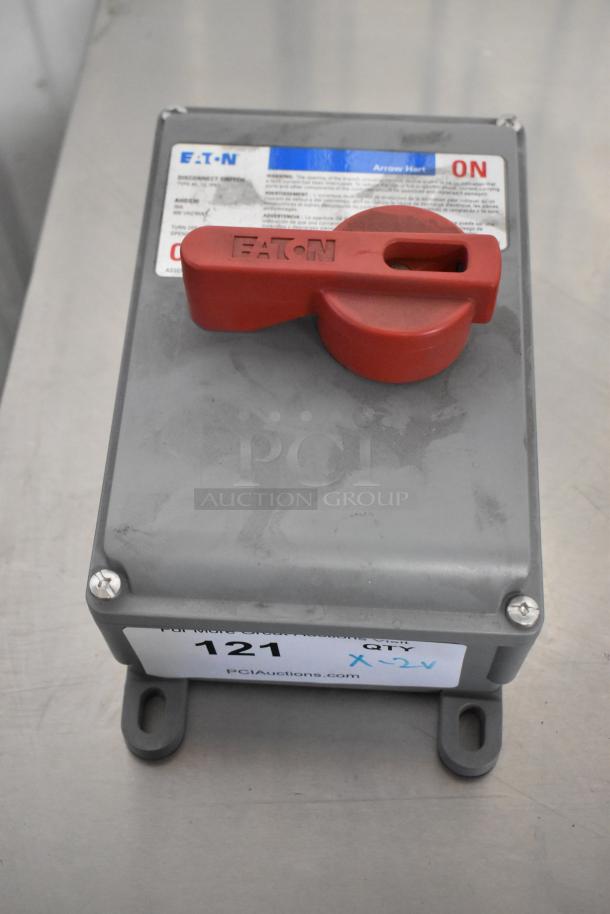 Eaton control box with red switch, labeled ON. Model info and warnings visible. Auction item #121.