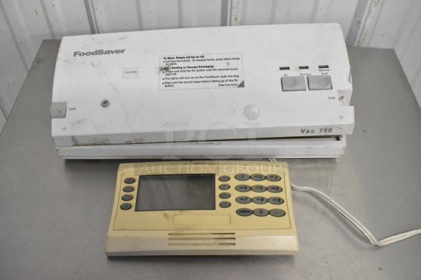 FoodSaver Vac750 vacuum bag sealer, used, with instructions on lid. Includes additional device, both showing wear.