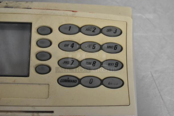 Food Saver Vac750 vacuum sealer keypad detail, showing buttons labeled 1-9, Command, and Enter. Slight wear visible.