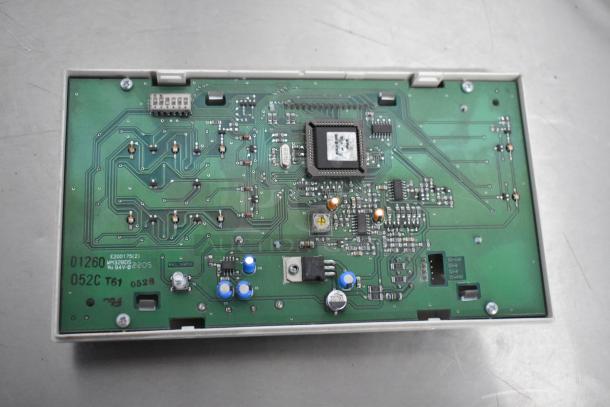 Interior view of circuit board indicating model numbers and components.
