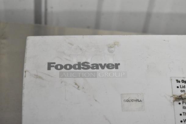 FoodSaver Vac750 vacuum bag sealer, visible wear, includes box. Goodwill label attached.
