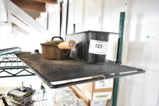 Metal pan with wooden handle, black poly bin on metal rack. Auction tag "123" visible on bin. Used condition.