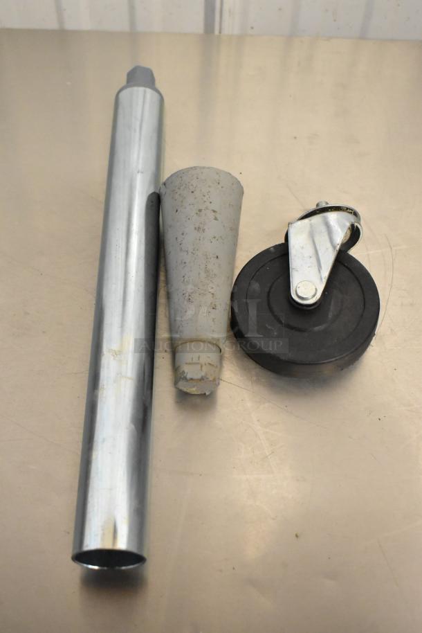 Metal leg, plastic cone, and commercial caster on table; part of 14-item auction. Light wear visible.