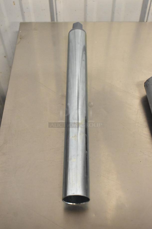 Metal leg, cylindrical shape, chrome finish, slight scuff marks, part of a 14-item lot with commercial casters.