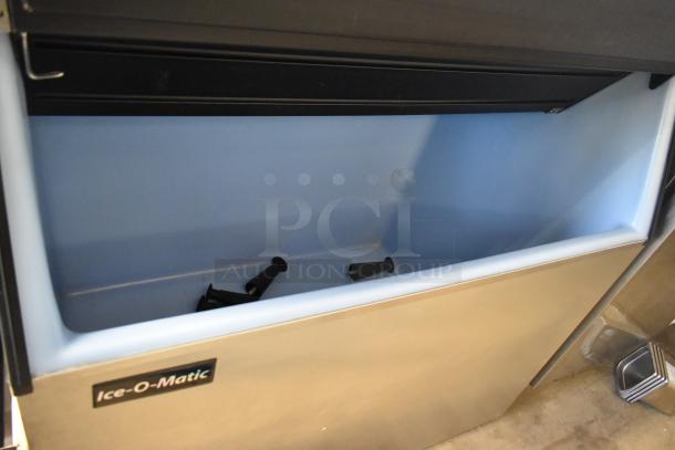 2018 Ice-O-Matic ICE1406HW7 ice machine head with B110PS bin, stainless steel finish, 208-230V, 1 phase. Clean condition.