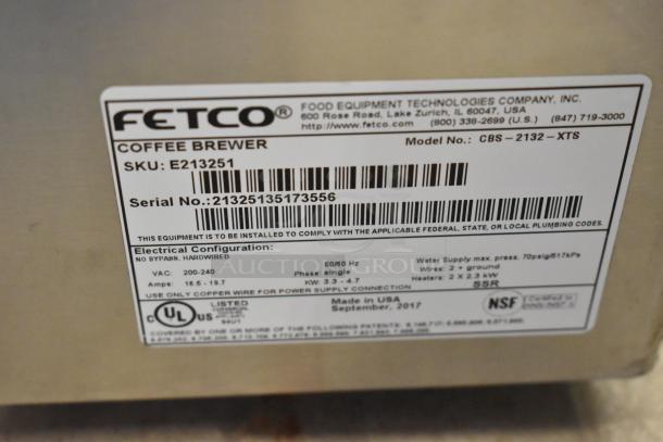 Label on Fetco CBS-2132-XTS coffee machine showing model, serial number, voltage, and manufacturing details.