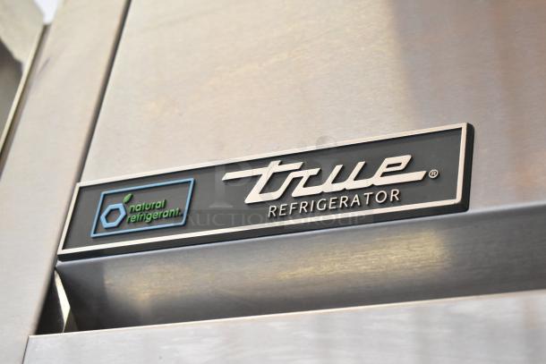 2020 True TG2R-2S-HC stainless steel commercial cooler, featuring "True Refrigerator" logo and "natural refrigerant" marking.
