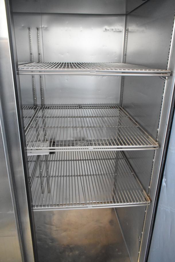 2020 True TG2R-2S-HC stainless steel 2-door reach-in cooler, adjustable shelves, commercial casters, 115V, 1 phase.