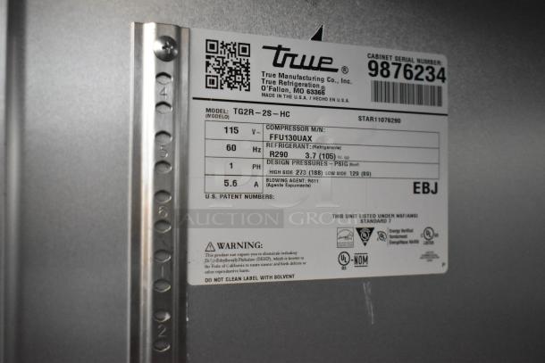 2020 True TG2R-2S-HC stainless steel commercial cooler label, showing model, voltage, and refrigerant details.