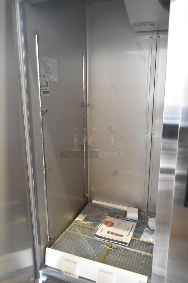 BRAND NEW KoolMore RIF-3D-SS Commercial 3 Door Freezer interior, scratch and dent, tags with specs visible, 115V, 1 Phase.