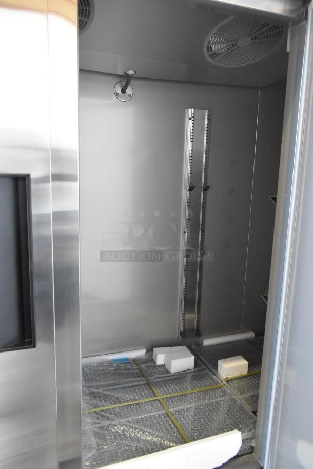 Brand new KoolMore RIF-3D-SS commercial 3-door reach-in freezer interior, 115V, with protective packaging and minor dents.