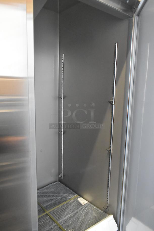 Brand new KoolMore RIF-3D-SS 3-door freezer, 115V, interior view showing shelving brackets, scratch and dent condition.