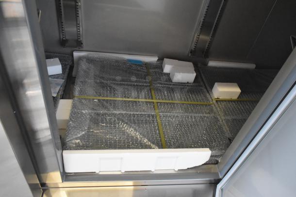 KoolMore RIF-3D-SS commercial 3-door freezer interior, new condition with packaging, 115V, 1 phase.