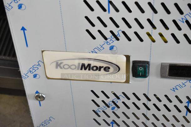 KoolMore KM-RPPS-3D79-GRT label and control panel with green power switch. Marked "Laser Film."