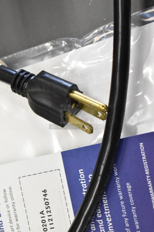 Close-up of power cord for Manitowoc CNF0201A ice maker. Includes warranty registration form with model and serial number.