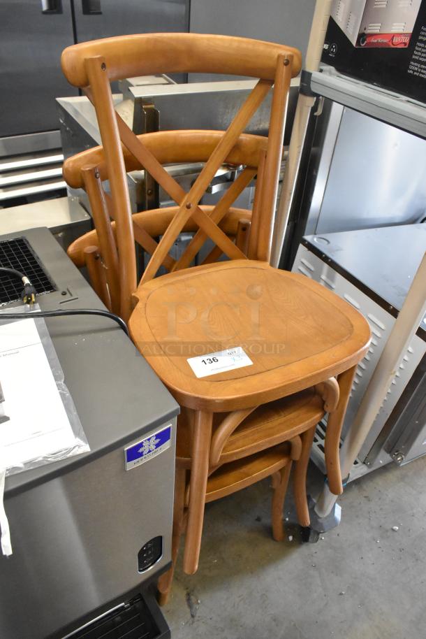 Three wooden dining-height chairs with cross-back design, in good condition. Label indicates lot number 136, quantity 3.