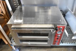 Brand new Avantco 177DPO18DS double deck countertop pizza/bakery oven; 240V, 1 phase. Minor scratches; red control panel.