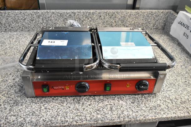 Brand new 2025 Avantco 177PG400 dual panini grill with grooved plates, minor scratches, 19 5/8" x 9 1/8" surface, 120V.