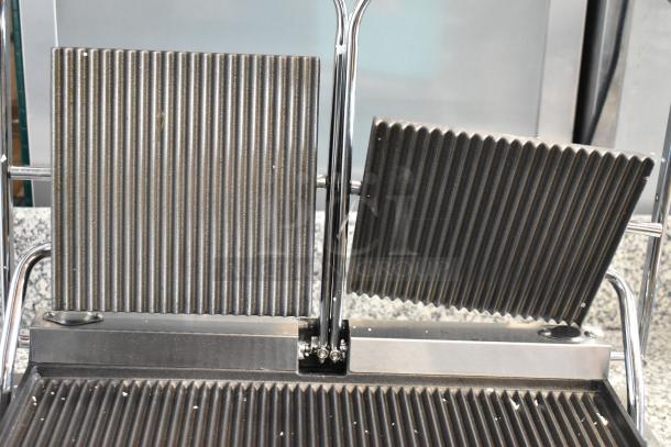 BRAND NEW Avantco 177PG400 dual panini grill with grooved plates, 19 5/8" x 9 1/8" cooking surface. 120V. Scratches visible.
