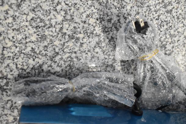 Brand new 2025 Avantco 177PG400 Panini Grill in bubble wrap. Dual grooved plates, 19 5/8" x 9 1/8" surface, 120V, 1 phase.