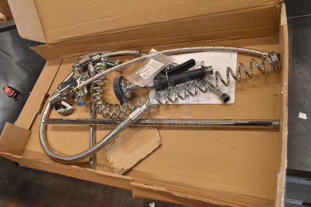 BRAND NEW SCRATCH AND DENT! Assure 190PRDX deck-mounted pre-rinse faucet with single inlet, components in box.