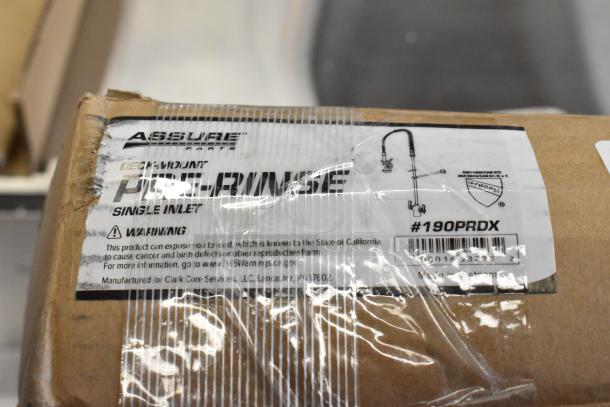 Assure 190PRDX deck-mounted pre-rinse faucet, new, scratch and dent, single inlet, labeled on packaging.