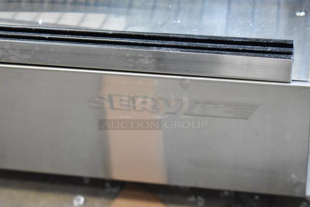 Brand new ServIt 423HDM26SA 26" heated display case with sliding door, stainless steel, missing glass panel, 120V, 1 phase.