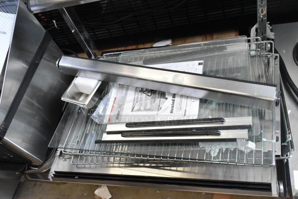 Brand new ServIt 423HDM26SA heated display case, 26" size, 3 shelves, missing glass. Includes manuals and accessories. 120V, 1 phase.