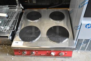 Brand new Avantco 177CER400 4-burner solid French-style electric range, 208/240V, 1 Phase, with minor scratches.
