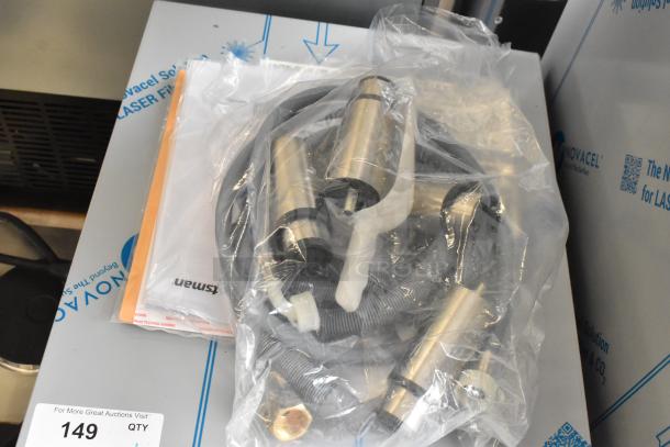 Brand new Scotsman UC0918GAX-1A ice machine parts, bagged with cables. Minor scratches visible. Model tag: 95 lb. capacity.