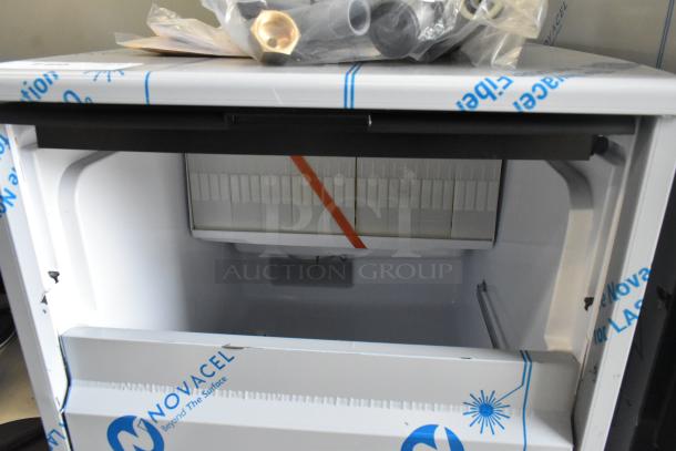 BRAND NEW Scotsman UC0918GAX-1A undercounter ice machine, 95 lb capacity, with slight scratches. 115V, 1 Phase, protective film visible.