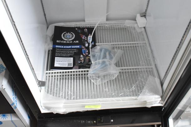 BRAND NEW Beverage Air MMF12HC-1-B merchandiser freezer, 11.9 Cu. Ft., includes manual and parts, seen unopened in packaging.