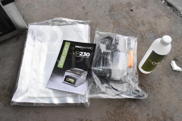 VacMaster VP230 user guide, vacuum bags, power cord, accessories, and oil for the 2025 chamber vacuum packaging machine.