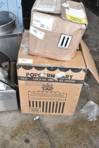 BRAND NEW Carnival King PM8CART cart for 8 oz. popcorn popper in box; labeled "POPCRN CART RED" with some dents visible.