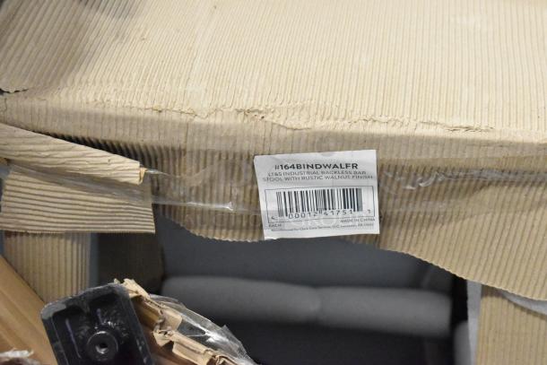 Bar stool in packaging, label reads "Industrial Backless Bar Stool with Rustic Walnut Finish, #164BINDWALFR, made in China."