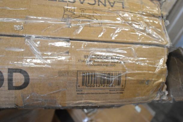 Cardboard box with clear tape, label reads "LT&S 24in Bar Height Table, Column and Rod," barcode visible. Package slightly dented.