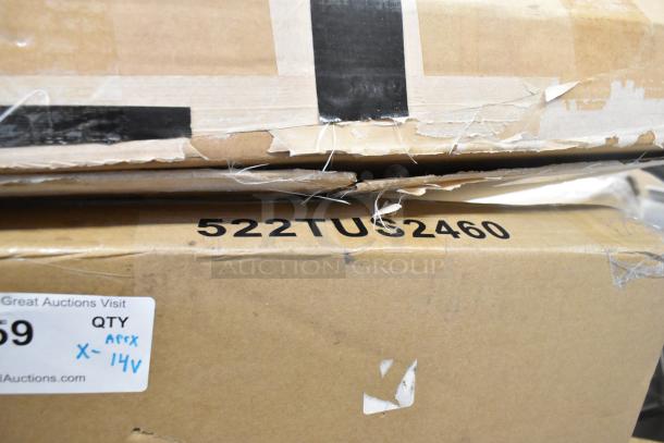 Cardboard boxes with visible wear, labeled "522TU92460." Includes scratch and dent items like a Koala Kare high chair and Regency sink.