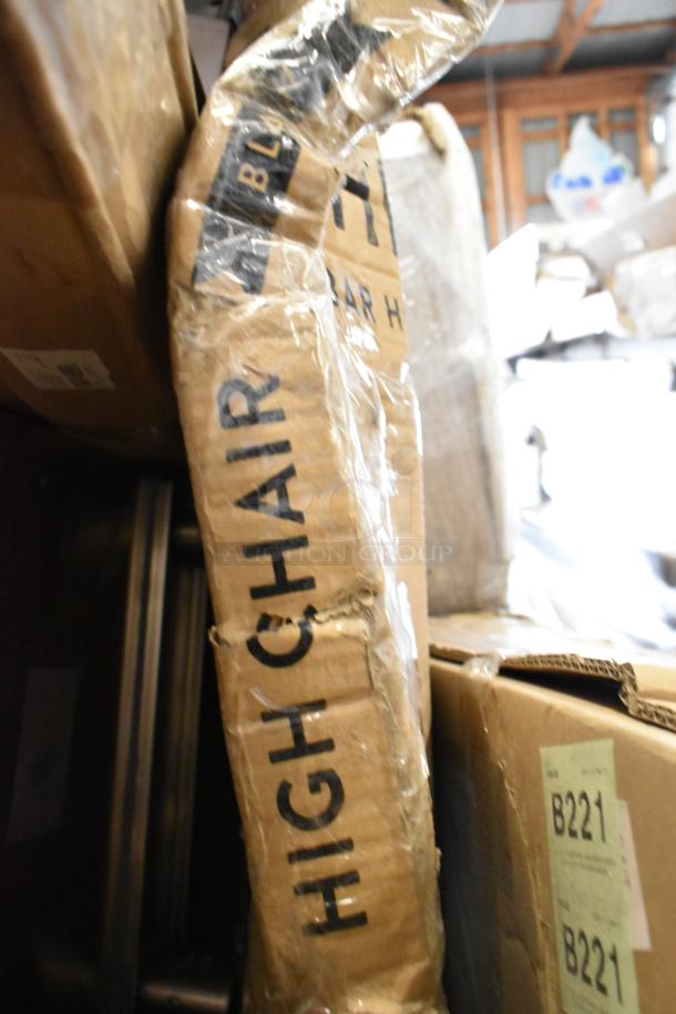 Packaging of a Koala Kare high chair, showing visible "High Chair" text with some wear. Box is part of a scratch and dent lot.